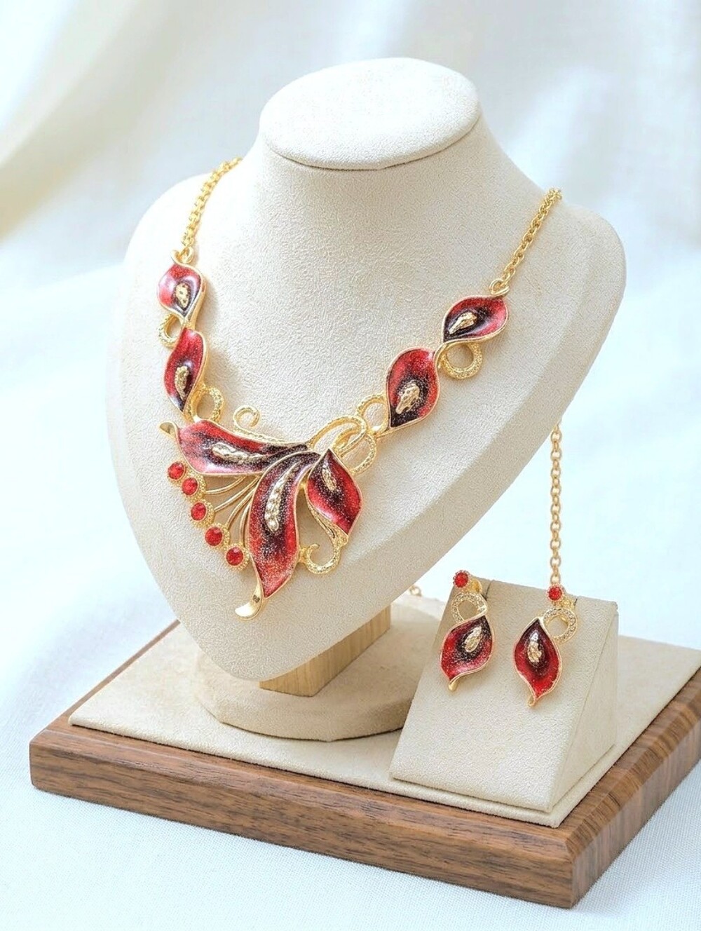 Gold plated red crystal peacock feather necklace and earrings set